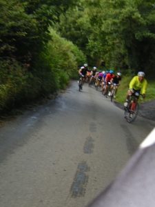 riders climbing behind